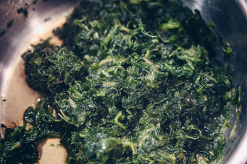 Frozen spinach leaves in a pot