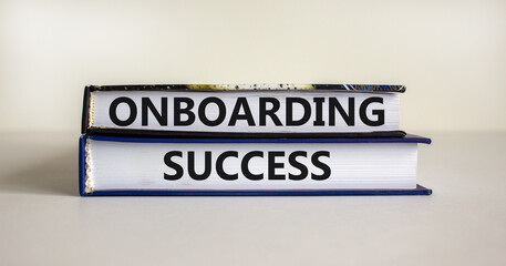 Onboarding success symbol. Books with words 'onboarding success' on beautiful white background. Business and onboarding success concept. Copy space.