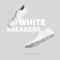 Flying white leather womens sneakers isolated on gray background. Fashionable stylish sports casual shoes. Creative minimalistic layout with footwear Mock up for your design Advertising for shoe store