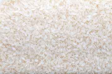Uncooked white rice background. Background and texture.