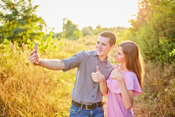 Couple taking photo of themselves with smart phone