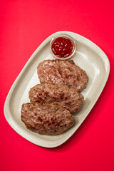 fried ground meat with tomato sauce on dish