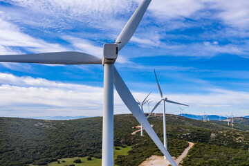 Wind turbines, renewable energy on a green hill. Wind farm