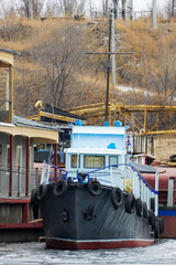 Wintering ships on a frozen river in their port. Volgograd. Russia