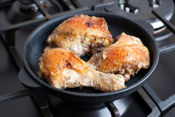 Fried chicken in a pan, homemade food