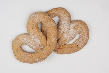 a pair of appetizing pretzels on white background
