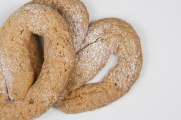 a pair of appetizing pretzels on white background