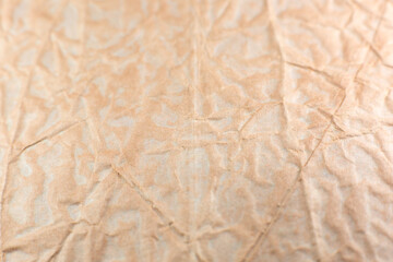 Rumpled beige background. Real texture of the wrapping texture.