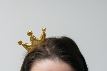 Golden crown on female head close up. Winner award ceremony concept. Vip.