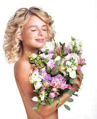 Fashion Beauty Model Girl with flowers. Bouquet of Beautiful Flowers. Perfect skin. Woman with a bouquet. Blonde with pink flowers.