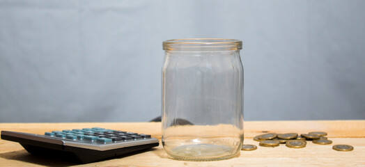 cumulative glass jar and calculator