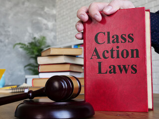 Class action laws are shown on the conceptual photo using the text