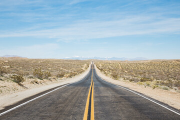 Fototapeta na wymiar Empty road in Mojave Desert, California