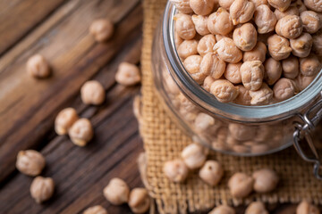 Dried raw chickpea on the wooden background