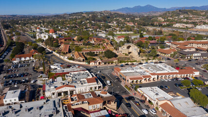 Daytime aerial view of the Spanish Colonial era mission and surrounding city of downtown San Juan...