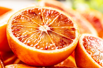 Blood sicilian oranges sliced with fresh melissa - close up