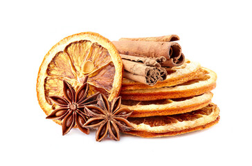 Dry oranges with  cinnamon  and anise on white background closeup. Citrus with spices.