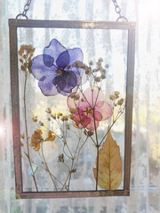 Framed pressed flowers in tiffany technique in stained glass