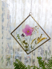 Framed pressed flowers in tiffany technique in stained glass