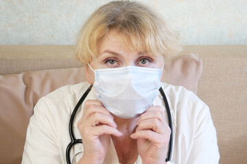 woman doctor wearing medical mask, closeup