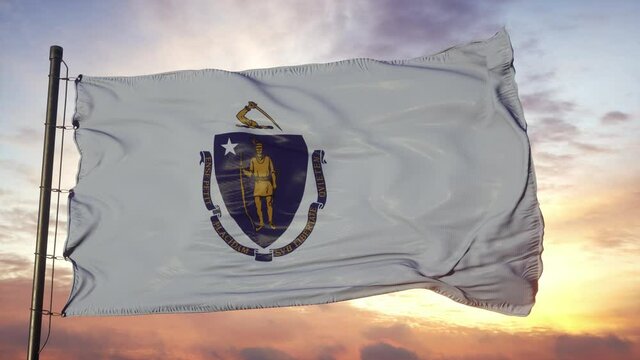 Flag of Massachusetts waving in the wind against deep beautiful sky at sunset