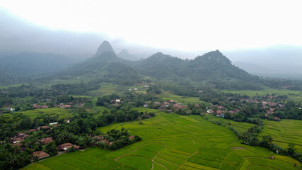 Aerial view of Rice fields on terraced of Cariu with noise cloud after rain, Bogor, Indonesia. Indonesia landscapes. 