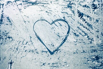 heart shape on frozen window background