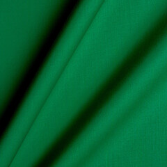Smooth fabric texture with folds and wawes. Close up silk background