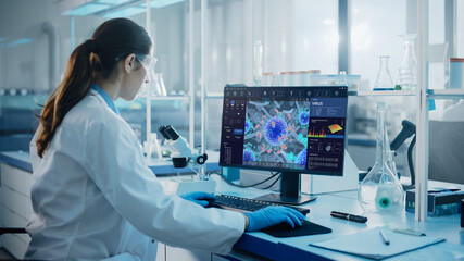 Advanced Medical Science Laboratory: Medical Scientist Working on Personal Computer with Screen...