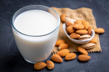 Glass of Almond milk and almond nuts