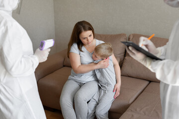 Doctor check patient body temperature using infrared forehead thermometer gun at home. Coronavirus, covid-19, Quarantine, high temperature