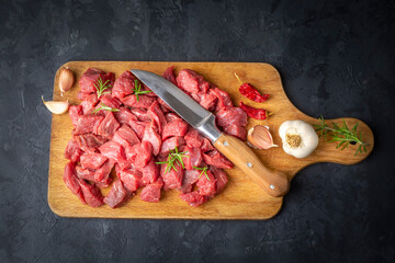 Heap of raw chopped beef isolated on cutting board