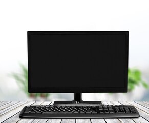 Modern desktop computer and keyboard on desk
