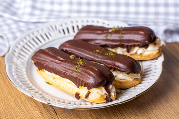 Traditional french eclairs with chocolate.