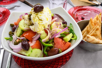 Traditional Greek salad with vegetables and local cheese served on Folegandros Island, Greece
