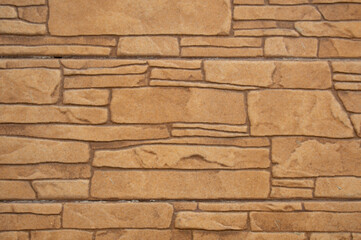 The texture of beige tiles is not smooth stones up close