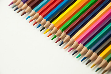 colored pencils on a white background. education concept. illustration of training.