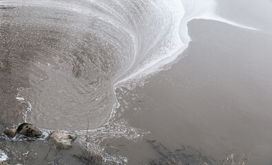 Dirty water surface with pollution foam