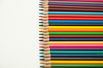 Fototapeta premium colored pencils on a white background. education concept. illustration of training.