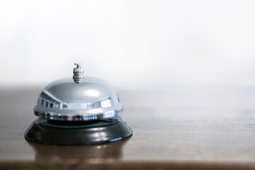 Service, hotel concept. Silver reception bell  .