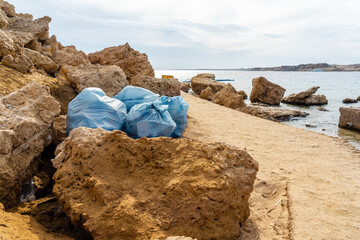 Rubbish on the beach. Ecological problem. Beach pollution