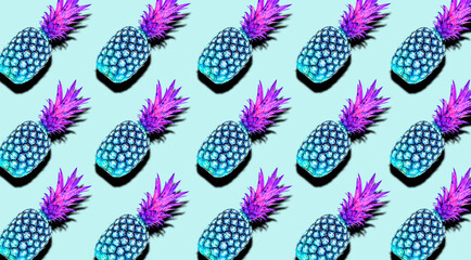 Creative pattern of fruit pineapples unusual blue and pink colors with shadows on a soft blue summer background. Clipping Path.