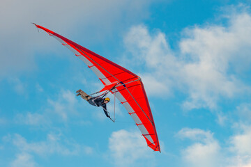 Bright paraglider wing in the sky.