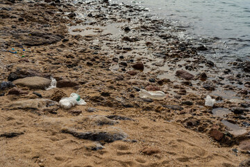 Dirty abandoned beach. Environmental or water pollution concept