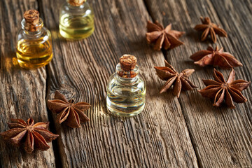 Bottles of essential oil with star anise