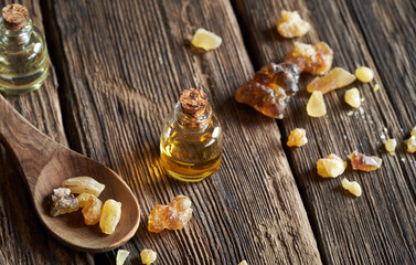 A bottle of frankincense essential oil and frankincense resin