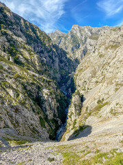 The Cares Route in the heart of Picos de Europa National Park, Cain-Poncebos, Asturias, Spain. Narrow and impressive canyon between cliffs, bridges, caves, footpaths and rocky mountains.