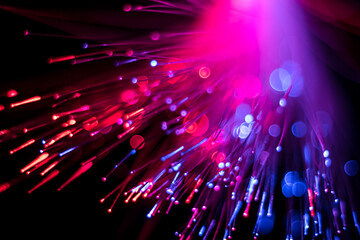 Luminous optical fiber, dots and lines. Selective focus. Abstract background.