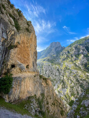 The Cares Route in the heart of Picos de Europa National Park, Cain-Poncebos, Asturias, Spain. Narrow and impressive canyon between cliffs, bridges, caves, footpaths and rocky mountains.