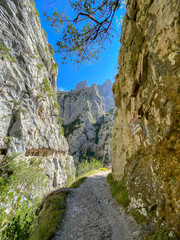 The Cares Route in the heart of Picos de Europa National Park, Cain-Poncebos, Asturias, Spain. Narrow and impressive canyon between cliffs, bridges, caves, footpaths and rocky mountains.